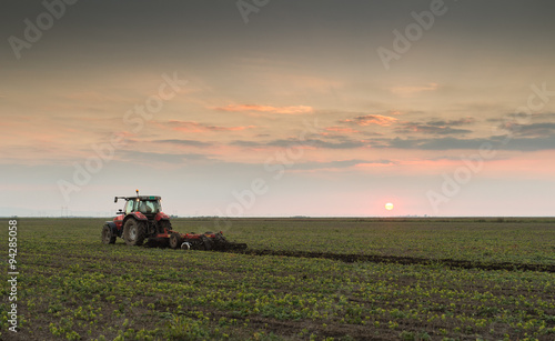 tractor plowing a field