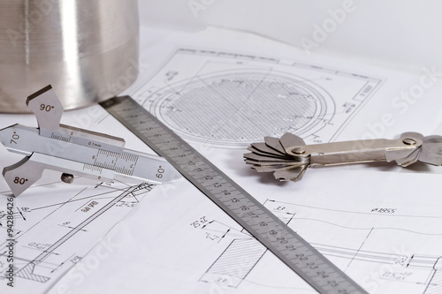 Templates for visual measurement control are on the drawing pipe photo