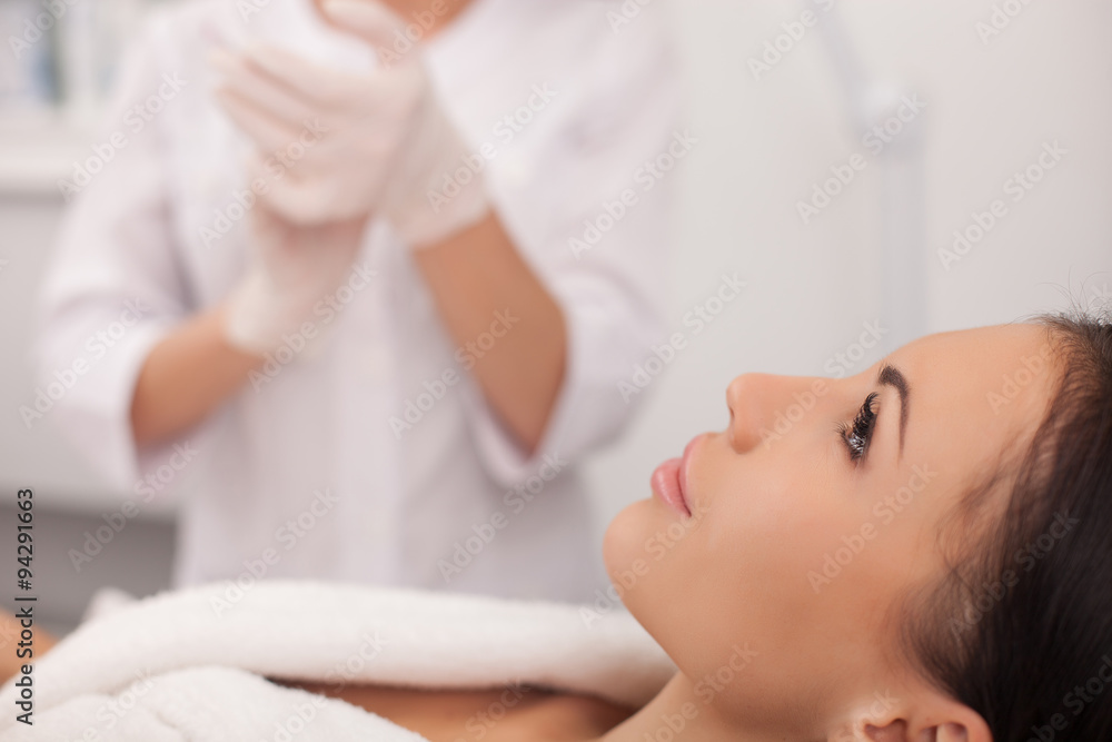Professional expert beautician is serving her patient Professional expert beautician is serving her patient
