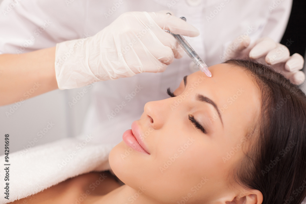 Professional cosmetologist is making procedure at clinic Professional cosmetologist is making procedure at clinic