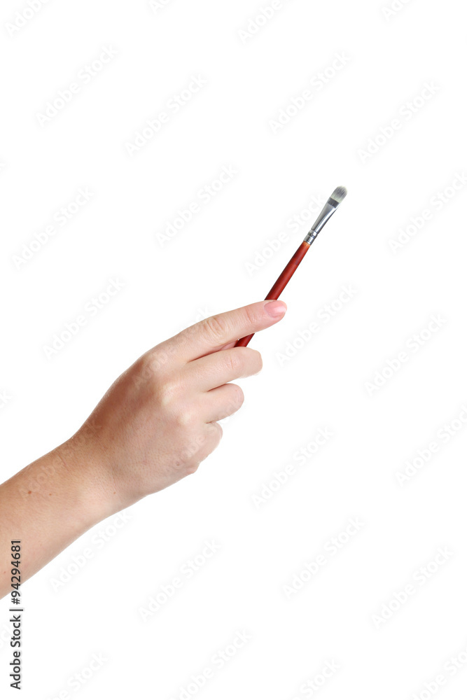 Female hand with brush for make-up isolated on white Female hand with brush for make-up isolated on white