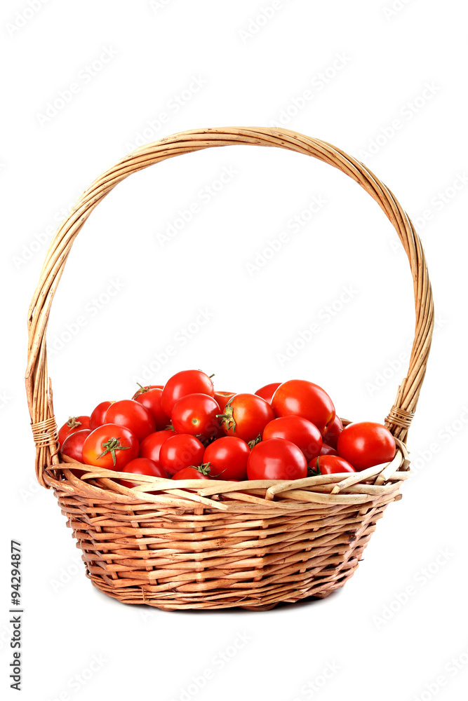 Fresh red tomatoes in basket isolated on white Fresh red tomatoes in basket isolated on white