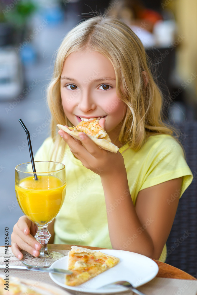 Pretty girls smiling when drinking juice and eating pizza Pretty girls smiling when drinking juice and eating pizza