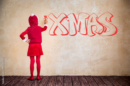 Kid making XMAS graffiti