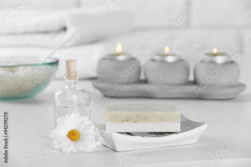 Composition of spa treatment on table, on white background