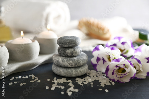Composition of spa treatment on table colorful background