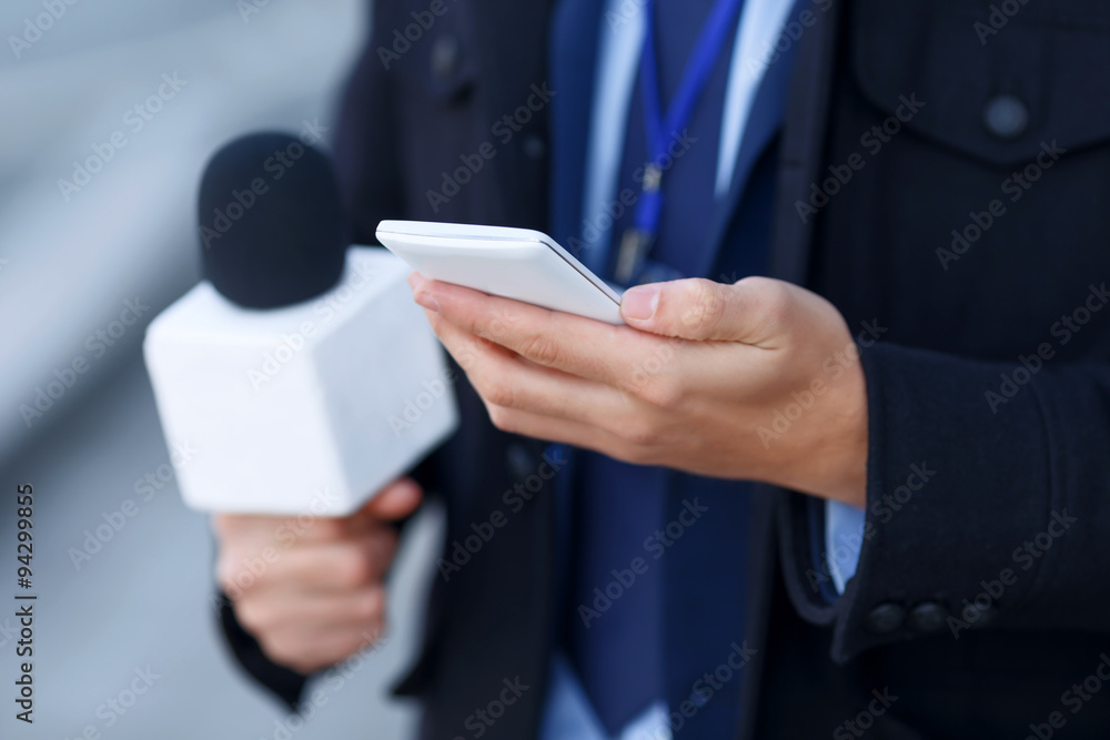 Close up of mans hand holding the smartphone. Close up of mans hand holding the smartphone.