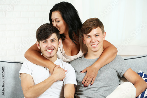 Happy family portrait on sofa at home