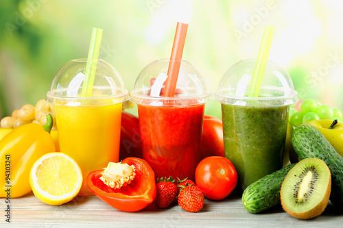 Fresh juice mix fruit, healthy drinks on wooden table, on bright background