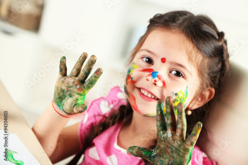 Cute little girl painting p...