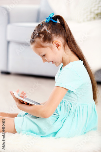Little cute girl with digit...