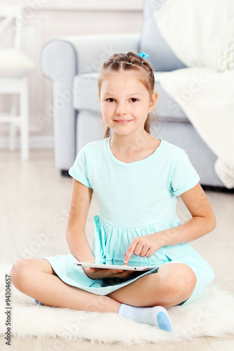 Little cute girl with digit...