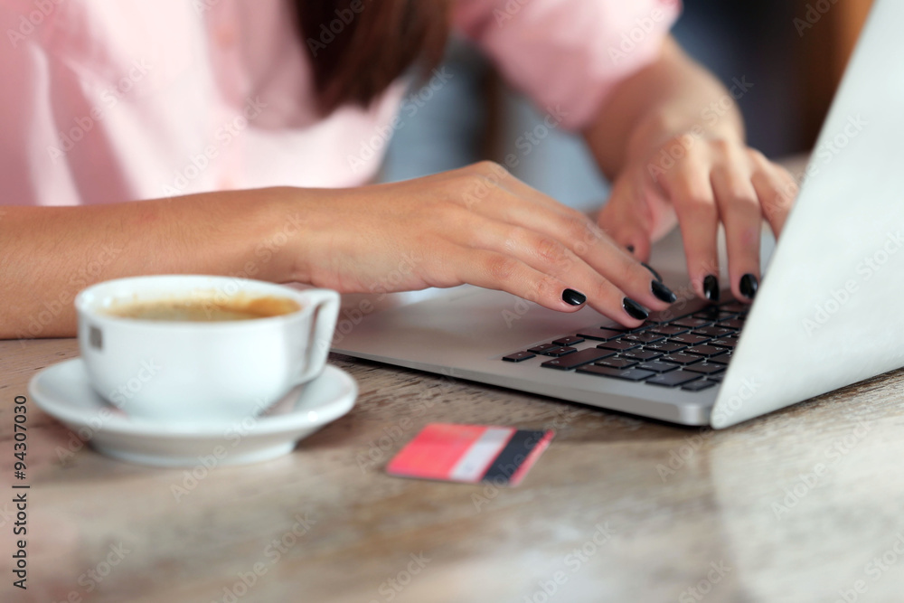 Young woman working with laptop in the office