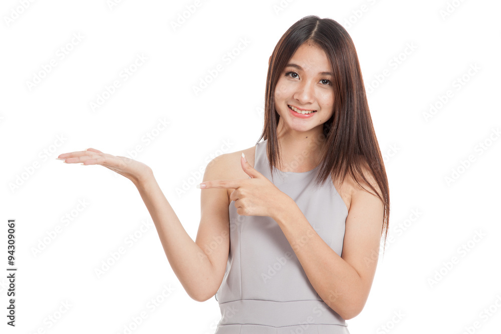 Beautiful young Asian woman point to palm hand Beautiful young Asian woman point to palm hand