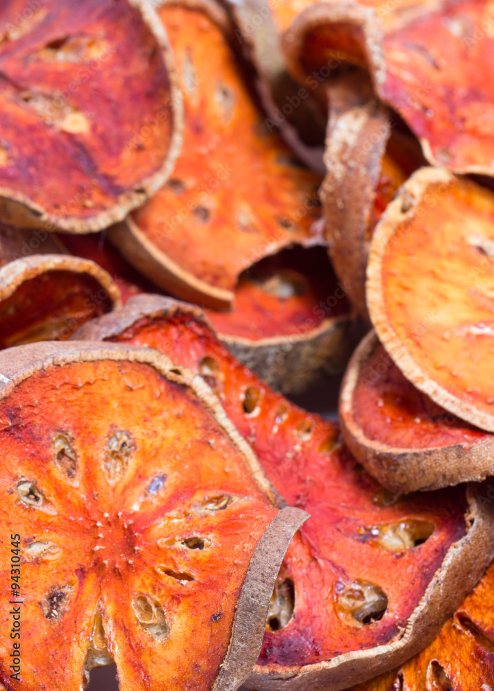 Slices of dried bael fruit isolated on white. Slices of dried bael fruit isolated on white.