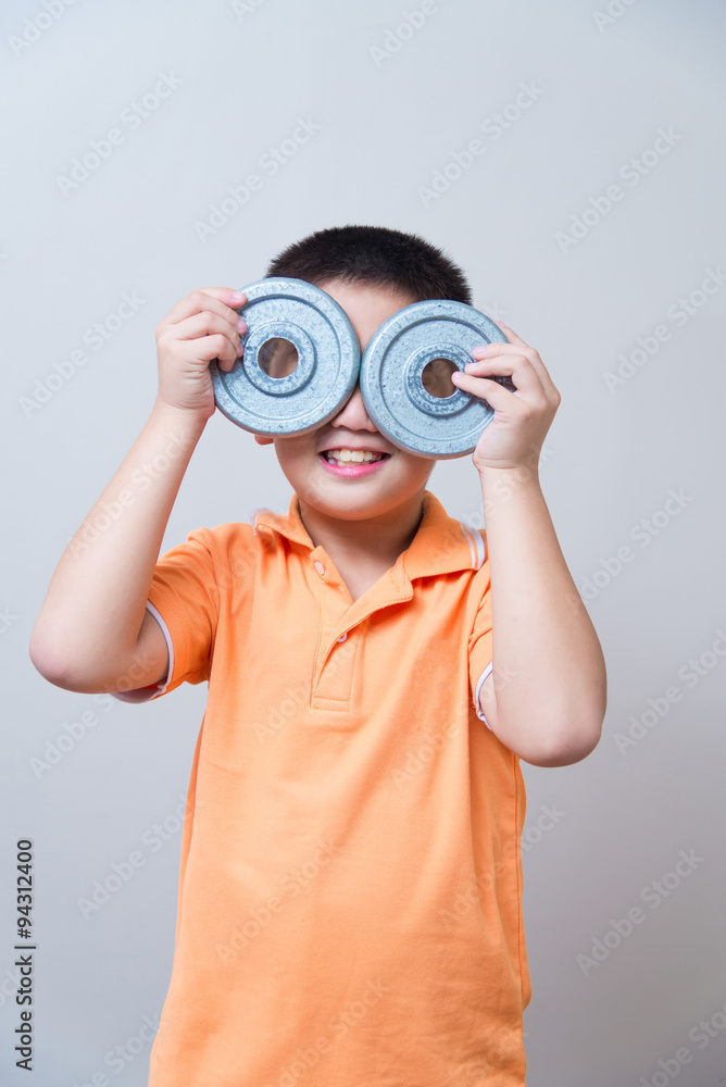 Asian boy joking gesture wearing fake glasses made with iron dum Asian boy joking gesture wearing fake glasses made with iron dum