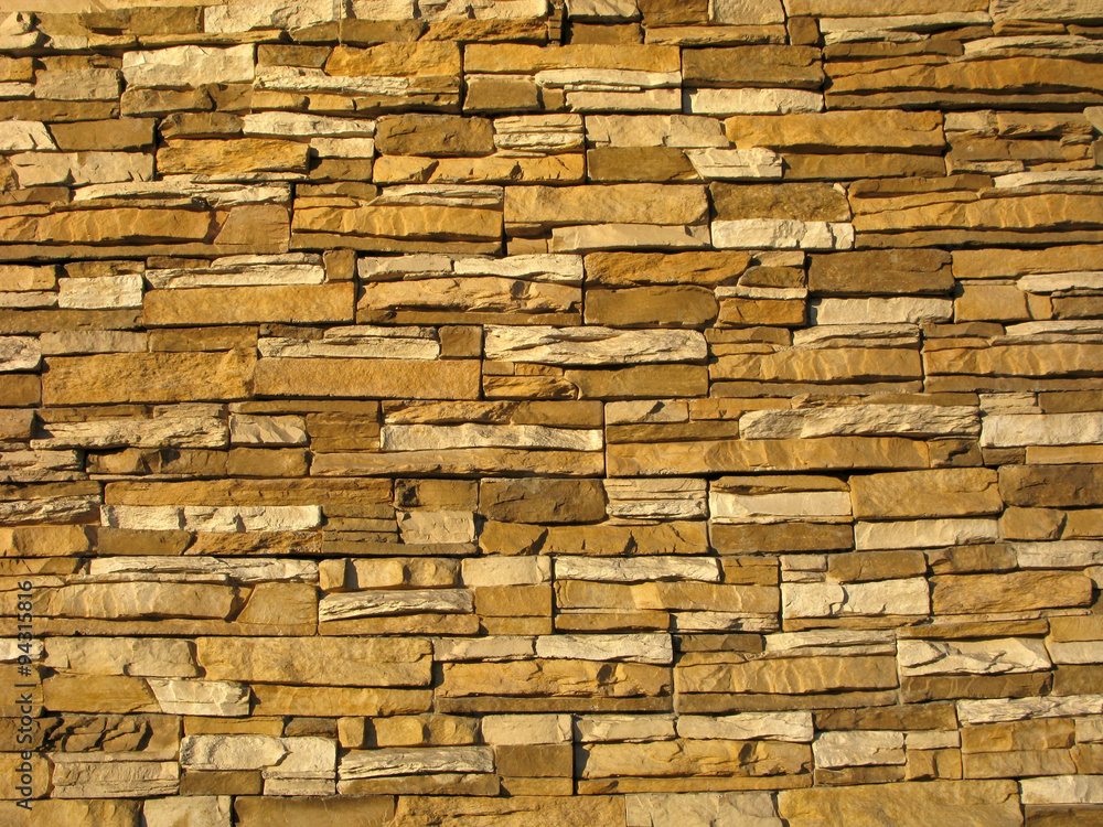 Naklejka Sztuczny kamień. Ściany wykonane ze sztucznego kamienia są nowoczesne w konstrukcji.