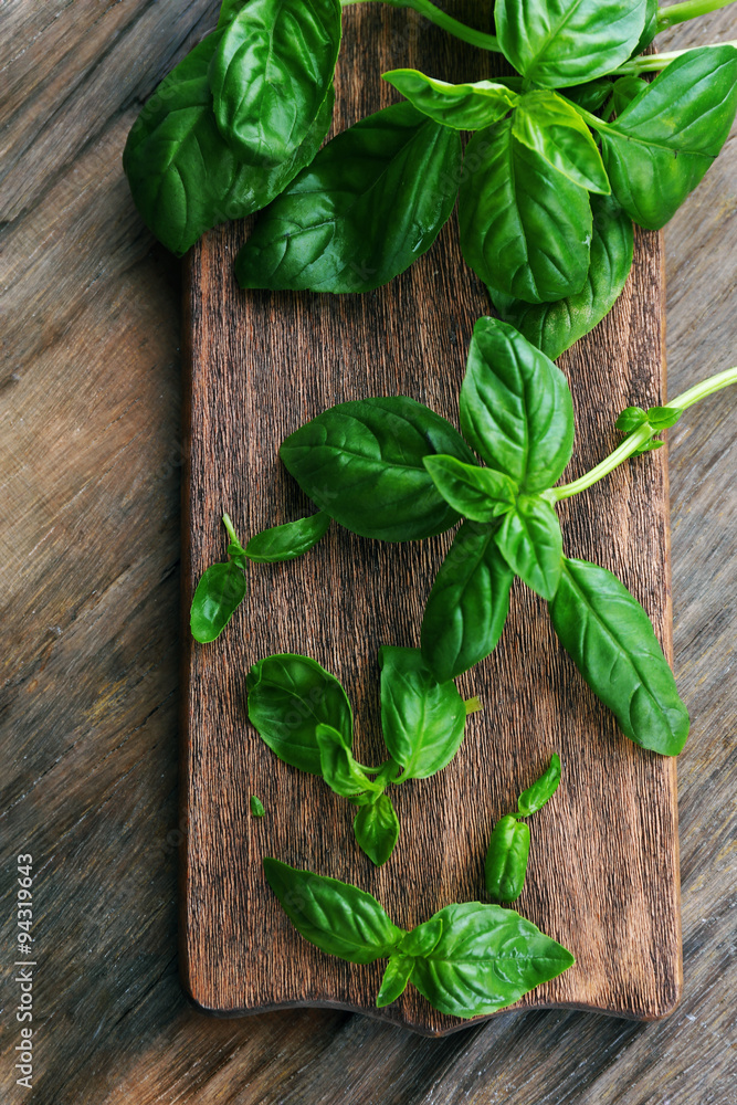 Green fresh basil on wooden background Green fresh basil on wooden background