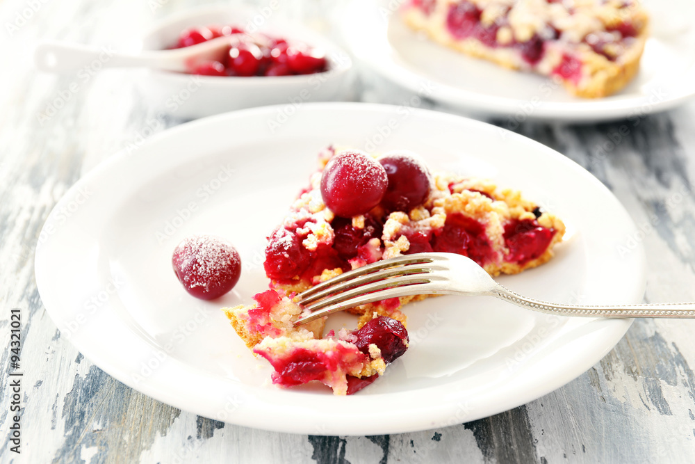 Tasty homemade pie with cherries on table close up Tasty homemade pie with cherries on table close up