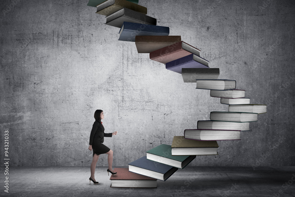 Business person step up flying book that look like stair Business person step up flying book that look like stair