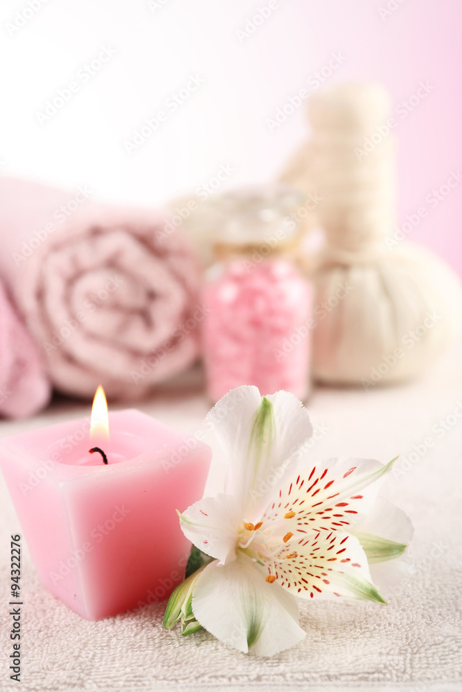 Spa treatment and flowers on wooden table, on light background Spa treatment and flowers on wooden table, on light background