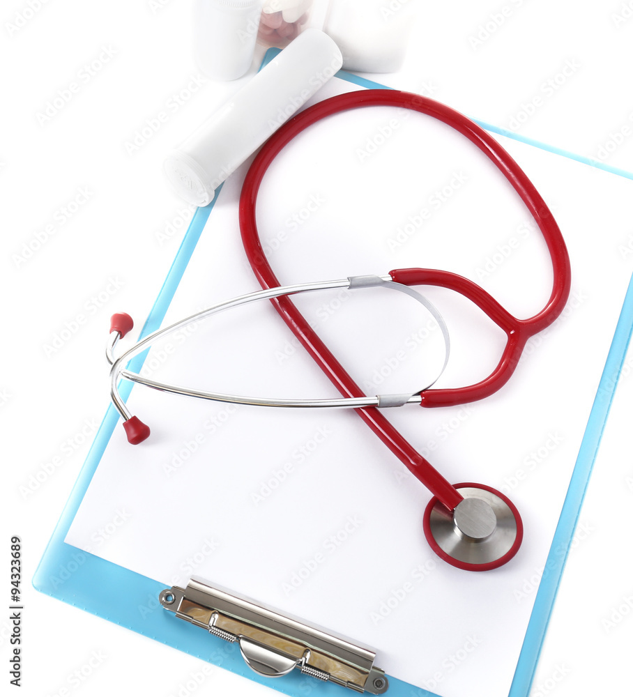 Medical stethoscope with clipboard and pills isolated on white Medical stethoscope with clipboard and pills isolated on white