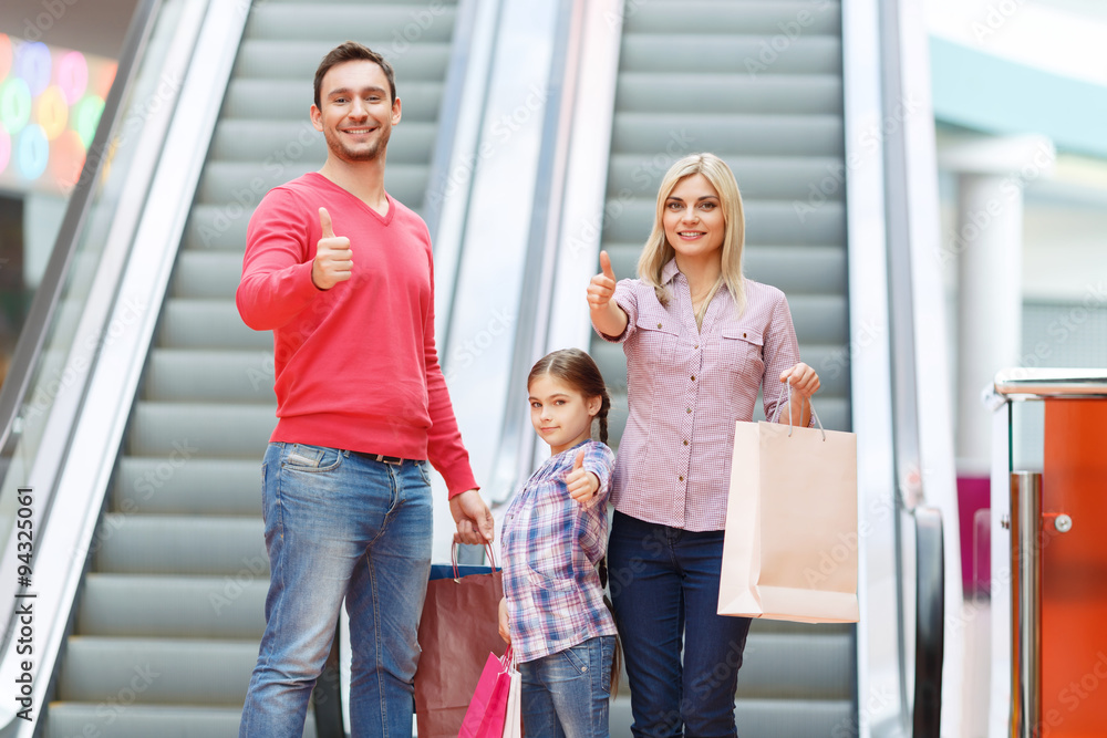 Loving family using escalator Loving family using escalator