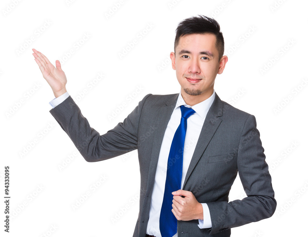 Young Businessman with hand showing blank sign Young Businessman with hand showing blank sign