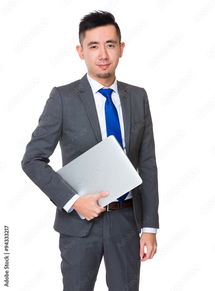 Young Businessman hold with notebook computer Young Businessman hold with notebook computer