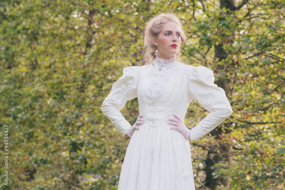 Retro victorian fashion woman in front of trees. Retro victorian fashion woman in front of trees.