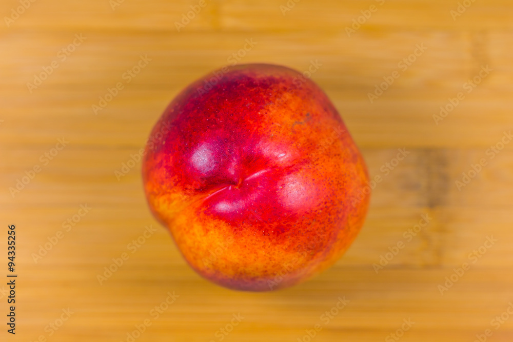 Nectarine on wooden background Nectarine on wooden background