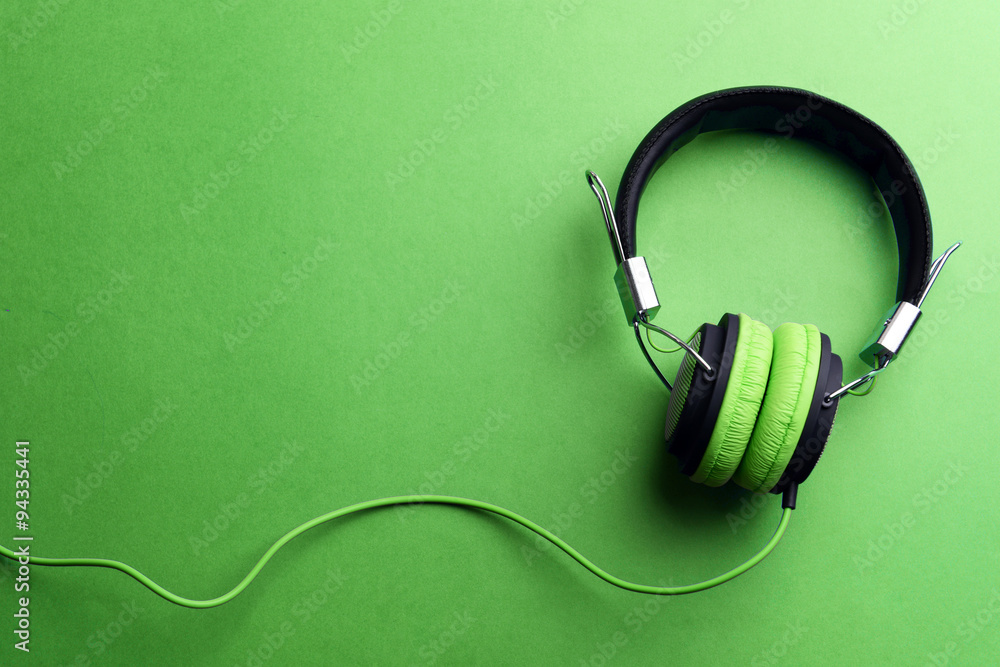 Headphones on green background Headphones on green background