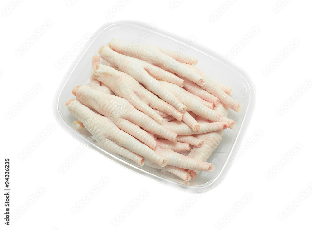 chicken feet in packaging  tray on white background