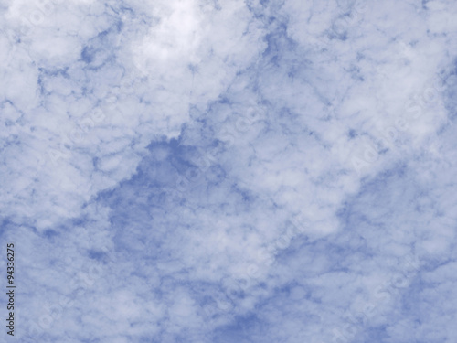 Background of blue sky with streaky clouds