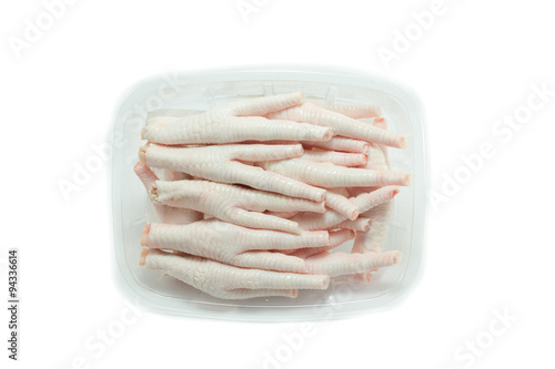 Raw chicken feet on white background