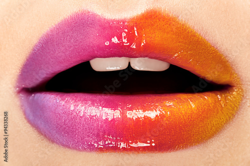 The lips with bright makeup. Closeup.