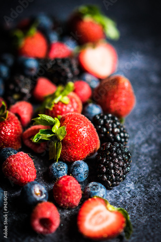 Berry mix on rustic black background