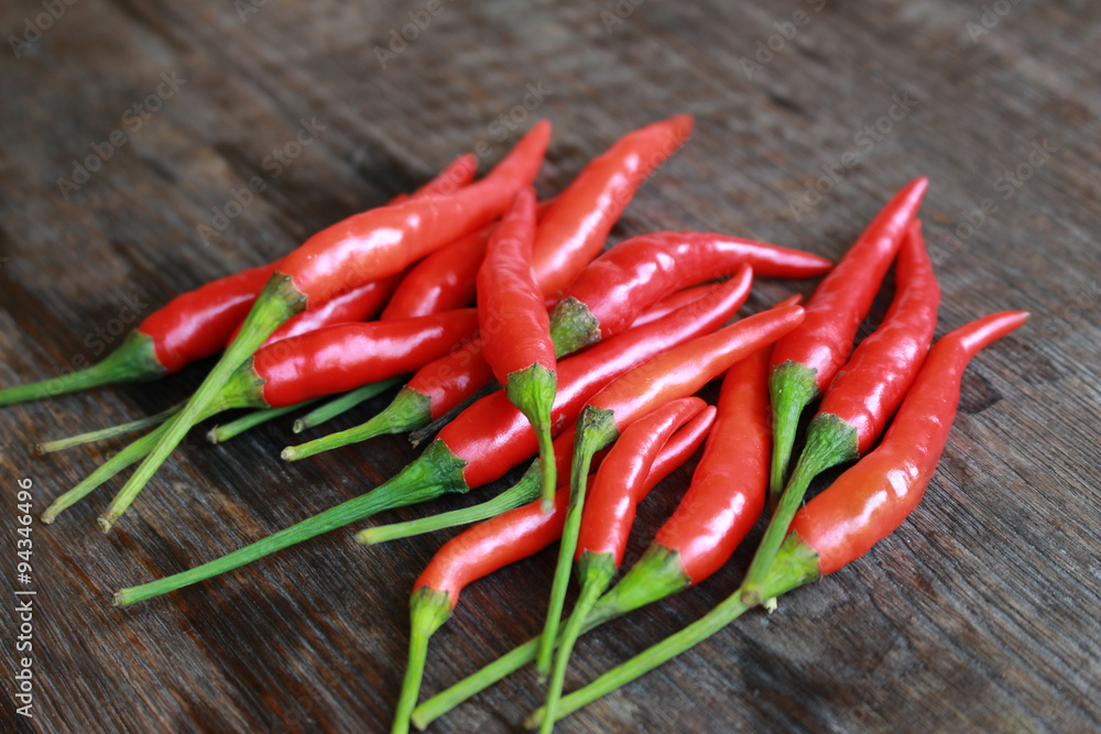 fresh red chilli on old wood background