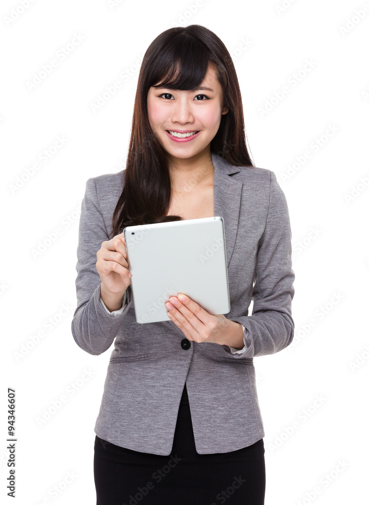 Asian Young Businesswoman use of the tablet pc Asian Young Businesswoman use of the tablet pc