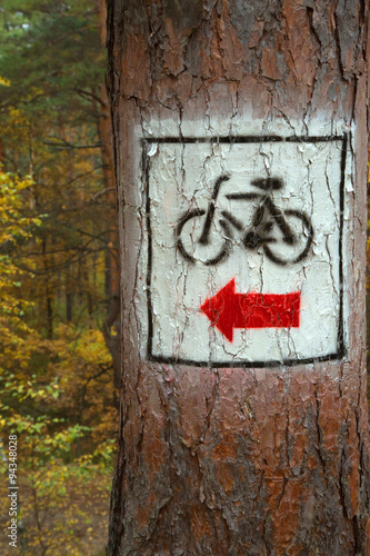 Sign for the cycling trail through the woods