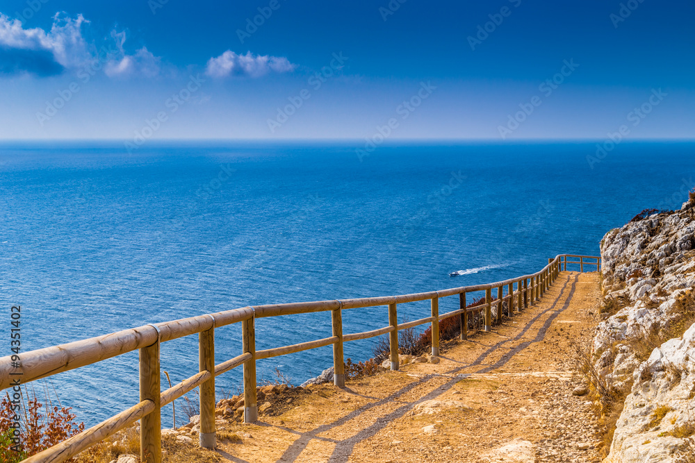 path on the steep rocks overlooking the sea