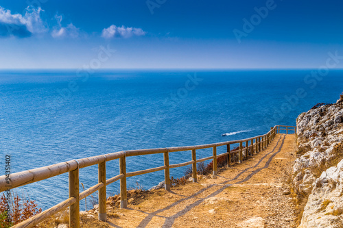 path on the steep rocks overlooking the sea