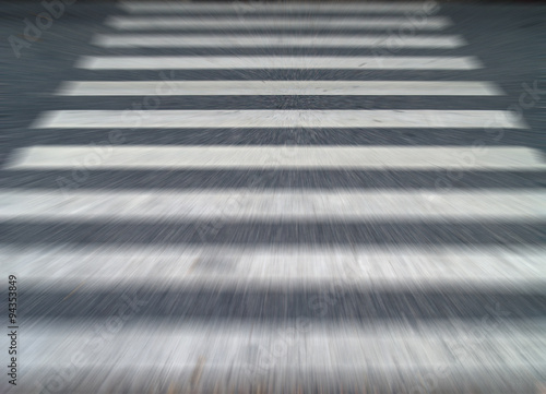 running escape forward across crosswalk traffic signs on asphalt street, close-up blurred motion background, concept about feel fear run away when faced with scary things © andy0man