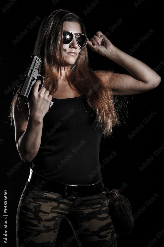 Military woman with a gun