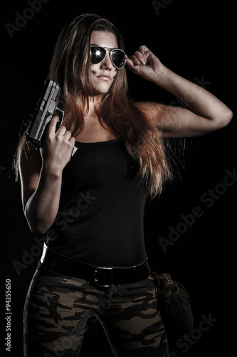 Military woman with a gun