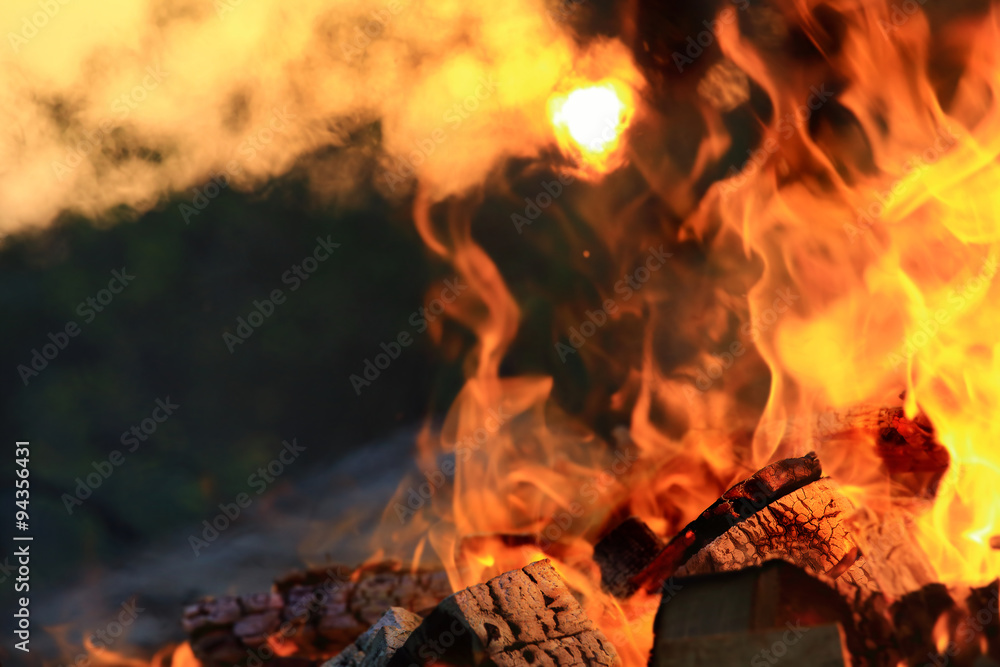 Fototapeta premium Burning charcoal and fire flames background.