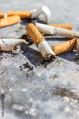 cigarette butts / Cigarette butts on a gray background