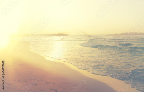 background of blurred beach and sea waves, vintage filter. 