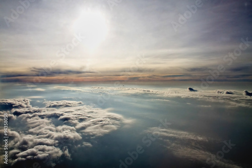 sun and clouds from an airplane window