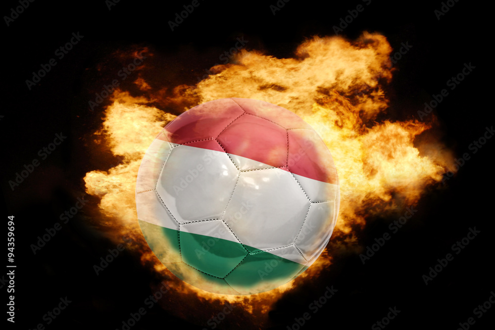 Fototapeta premium football ball with the flag of hungary on fire